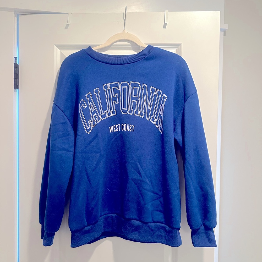 Women’s graphic royal blue crew neck- size small